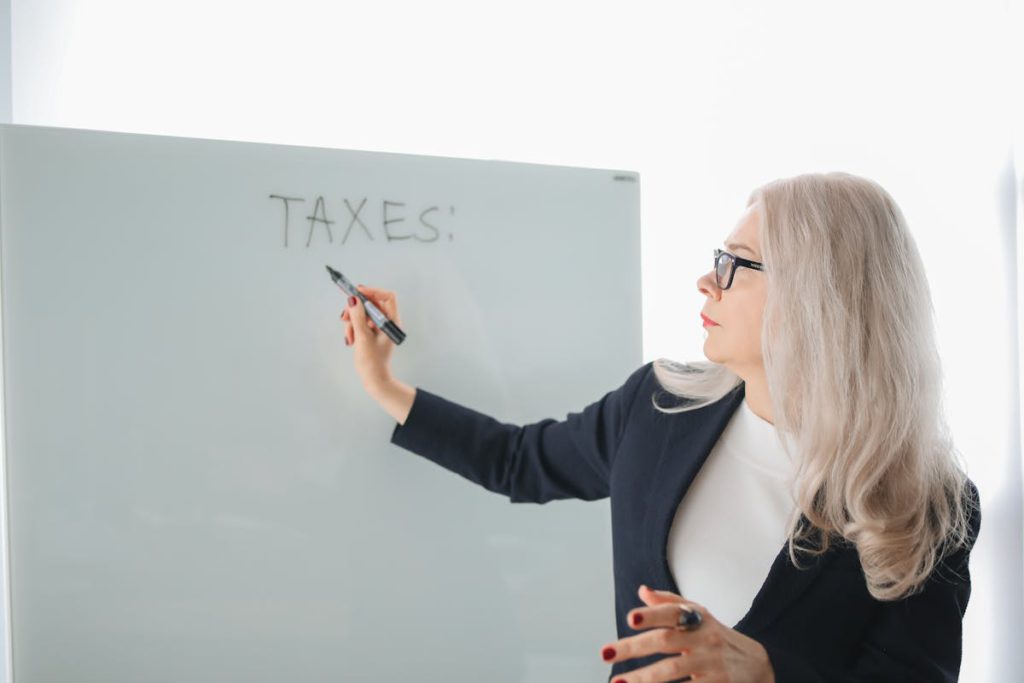 Expert explaining tax debt management on whiteboard